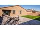 Landscaped backyard with artificial turf and a patio at 2033 W Burnside Trl, Phoenix, AZ 85085