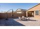 Relaxing backyard patio with seating area and umbrella at 2033 W Burnside Trl, Phoenix, AZ 85085