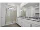 Double vanity bathroom with granite countertop and walk-in shower at 2033 W Burnside Trl, Phoenix, AZ 85085