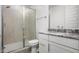 Clean bathroom with a walk-in shower and granite vanity at 2033 W Burnside Trl, Phoenix, AZ 85085