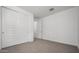 Simple bedroom with carpet and neutral wall colors at 2033 W Burnside Trl, Phoenix, AZ 85085