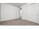 Spacious bedroom with carpet and double door closet at 2033 W Burnside Trl, Phoenix, AZ 85085