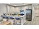 Modern kitchen with stainless steel appliances and an island at 2033 W Burnside Trl, Phoenix, AZ 85085