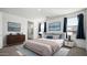 Spacious bedroom with a dresser and ensuite bathroom at 2033 W Burnside Trl, Phoenix, AZ 85085