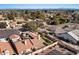 Aerial view showing house, backyard, and surrounding neighborhood with mountain view at 2309 W Shawnee Dr, Chandler, AZ 85224