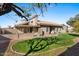 Spacious backyard with grassy lawn and a covered patio area at 2309 W Shawnee Dr, Chandler, AZ 85224