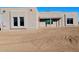 Newly constructed home with stucco exterior and wood-beam accents at 24271 N 194Th Ave, Surprise, AZ 85387