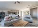 Bright and airy living room with sectional sofa and kitchen views at 24271 N 194Th Ave, Surprise, AZ 85387