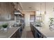 Bright, modern kitchen boasts stainless steel appliances, sleek countertops, and designer finishes for a chef-inspired space at 24301 N 194Th Ave, Surprise, AZ 85387