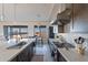 Modern kitchen with sleek countertops, stainless steel appliances, and ample natural light creating an inviting atmosphere at 24301 N 194Th Ave, Surprise, AZ 85387