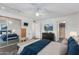 Spacious bedroom with mirrored closet doors and ceiling fan at 2609 S Country Club Way, Tempe, AZ 85282