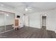 Bright bedroom with hardwood floors and mirrored closet at 2609 S Country Club Way, Tempe, AZ 85282