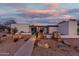 Mid-century modern home with landscaped yard and unique rock features at 2609 S Country Club Way, Tempe, AZ 85282