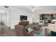 Open living room features a modern aesthetic with comfortable seating and a view of the kitchen at 2609 S Country Club Way, Tempe, AZ 85282