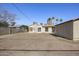 Spacious backyard features a shed and a view of the city skyline at 27 W Lewis Ave, Phoenix, AZ 85003