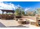 Outdoor entertainment area with fire pit and built-in BBQ at 2838 E Shady Spring Trl, Phoenix, AZ 85024