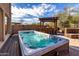 Inviting backyard features an in-ground spa and a bar top, perfect for entertaining at 2838 E Shady Spring Trl, Phoenix, AZ 85024