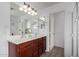 Double vanity bathroom with updated wood cabinets and large mirrors at 2838 E Shady Spring Trl, Phoenix, AZ 85024
