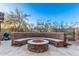 Stone fire pit with curved seating in backyard at 2838 E Shady Spring Trl, Phoenix, AZ 85024
