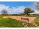 Play area with swings, a bench, and wood chips at 2838 E Shady Spring Trl, Phoenix, AZ 85024