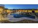 Lovely kidney-shaped pool surrounded by a patio and comfortable seating at 2906 E Frye Rd, Phoenix, AZ 85048