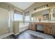 Bathroom with double vanity, soaking tub, and walk-in shower at 2906 E Frye Rd, Phoenix, AZ 85048