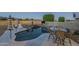 Enjoy this kidney shaped pool with a patio and seating area at 2906 E Frye Rd, Phoenix, AZ 85048