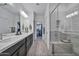 Elegant bathroom with double vanity, walk-in shower, and large closet at 29321 N Horton Creek Trl, Rio Verde, AZ 85263