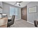 Home office with built-in wood wall unit and desk at 29321 N Horton Creek Trl, Rio Verde, AZ 85263