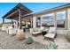 Relaxing patio with pergola, lounge chairs, and fire pit at 29321 N Horton Creek Trl, Rio Verde, AZ 85263