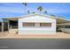 Mobile home with carport and palm trees at 305 S Val Vista Dr # 417, Mesa, AZ 85204