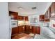 Galley kitchen with ample wood cabinets at 305 S Val Vista Dr # 417, Mesa, AZ 85204