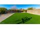 Artificial turf backyard with playset and basketball hoop at 31310 N 26Th Dr, Phoenix, AZ 85085
