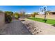 Grass backyard with basketball hoop and playset at 31310 N 26Th Dr, Phoenix, AZ 85085