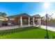 Backyard with covered patio, basketball hoop and play area at 31310 N 26Th Dr, Phoenix, AZ 85085