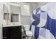 Clean bathroom with dark vanity and shower at 31310 N 26Th Dr, Phoenix, AZ 85085