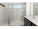 Clean bathroom with a walk-in shower and modern vanity at 31310 N 26Th Dr, Phoenix, AZ 85085