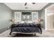 Comfortable bedroom featuring a ceiling fan and window shutters at 31310 N 26Th Dr, Phoenix, AZ 85085
