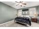 Bright bedroom with a ceiling fan, large windows, and ample space at 31310 N 26Th Dr, Phoenix, AZ 85085