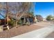House exterior view, showing landscaping and a paved driveway at 31310 N 26Th Dr, Phoenix, AZ 85085