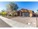 Single-story home with a two-car garage and landscaped front yard at 31310 N 26Th Dr, Phoenix, AZ 85085