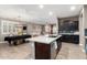 Spacious kitchen featuring an island, dark cabinetry, and modern appliances at 31310 N 26Th Dr, Phoenix, AZ 85085