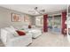 Living area with sectional sofa, fireplace and access to backyard at 31310 N 26Th Dr, Phoenix, AZ 85085