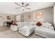 Open living space with sectional sofa and adjacent dining area at 31310 N 26Th Dr, Phoenix, AZ 85085