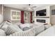 Spacious living room featuring a large sectional sofa and fireplace at 31310 N 26Th Dr, Phoenix, AZ 85085