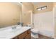 Clean bathroom, featuring a shower/tub combo and wood vanity at 38913 N 21St Ave, Phoenix, AZ 85086