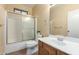 Bathroom with tub, shower, and wood vanity at 38913 N 21St Ave, Phoenix, AZ 85086