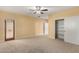 Spacious bedroom with door to backyard and built-in shelving at 38913 N 21St Ave, Phoenix, AZ 85086