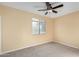 Bright bedroom featuring a ceiling fan and window at 38913 N 21St Ave, Phoenix, AZ 85086