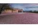 Tan stucco house with brown garage door, and gravel yard at 38913 N 21St Ave, Phoenix, AZ 85086